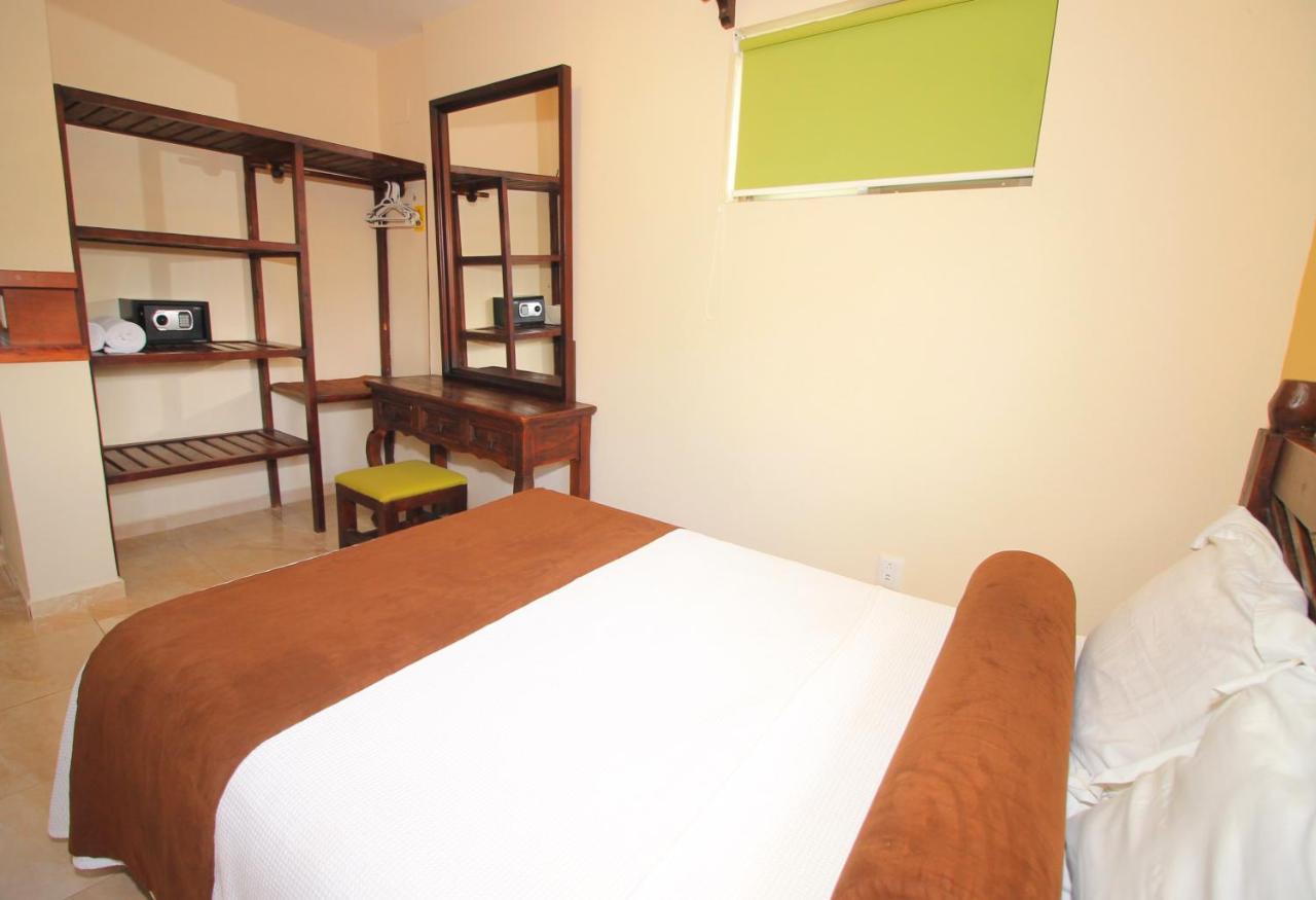 Papagayo Hotel Boutique 普拉亚卡门 外观 照片 A bedroom at the hotel