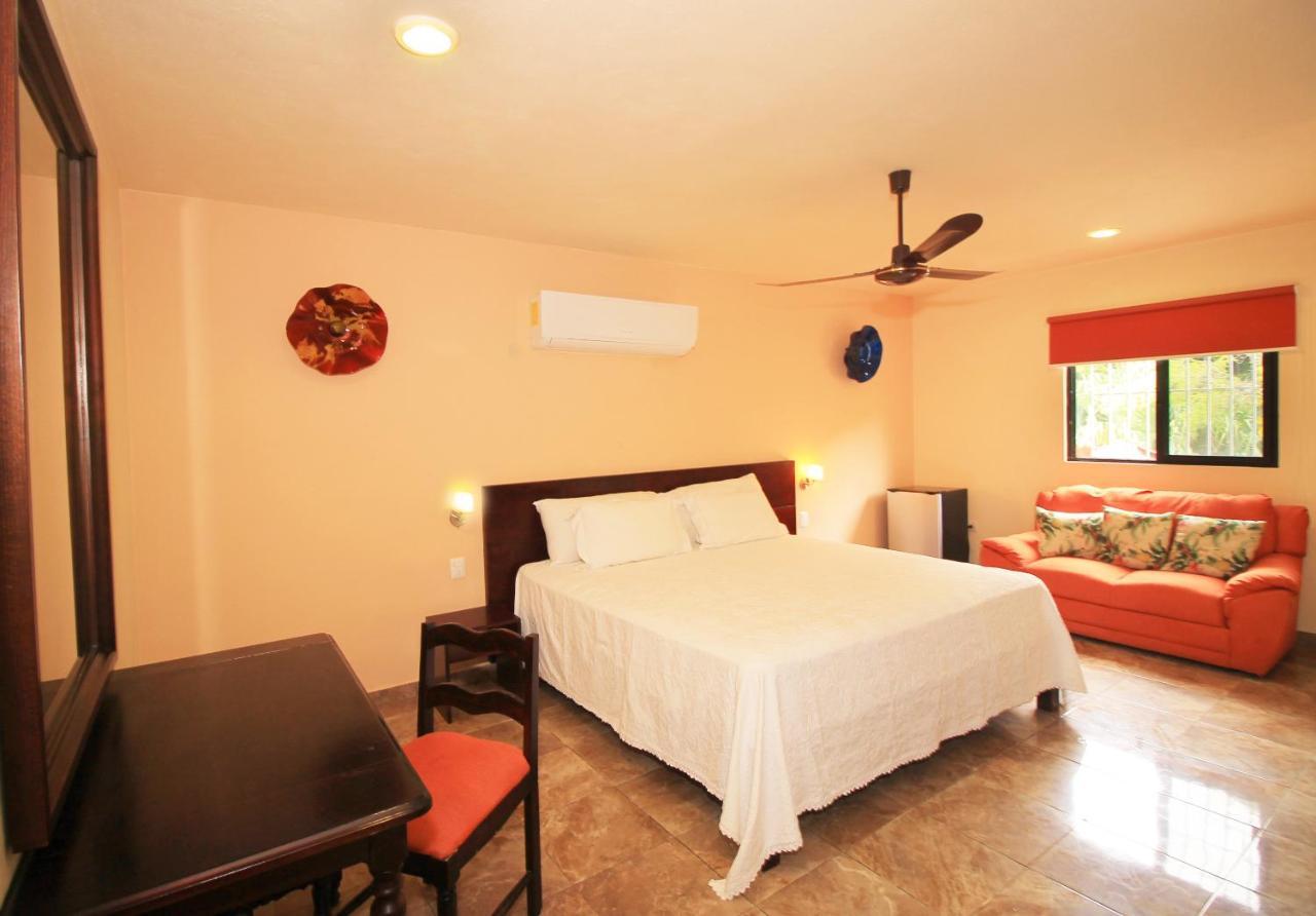 Papagayo Hotel Boutique 普拉亚卡门 外观 照片 A bedroom at the hotel